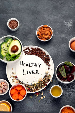 Best products for healthy liver on dark gray background. Clean eating concept. Top view, flat lay, copy spaceの写真素材