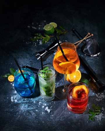 Cocktails assortment served on dark background. Classic drink menu concept.の写真素材