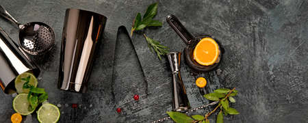 Cocktail bar equipment on dark background. Bartender instruments. Top view, flat lay, copy space, panoramaの写真素材