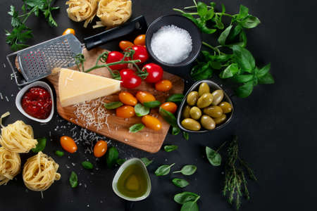 Italian food and snacks on dark background. Traditional food concept. Top view, flat lay copy spaceの写真素材