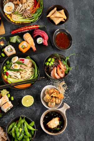Japanese dishes and snacks on gray background. Traditional food concept. Top view, flat lay, copy spaceの写真素材