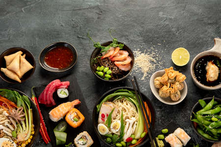 Japanese dishes and snacks on gray background. Traditional food concept. Top view, flat lay, copy spaceの写真素材