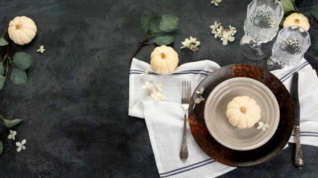 Harvest table setting on dark background. Holiday season concept. Top view, flat lay, copy spaceの写真素材