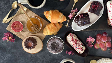 French dishes and appetizers served on dark background. Traditional food concept. Top view, flat...