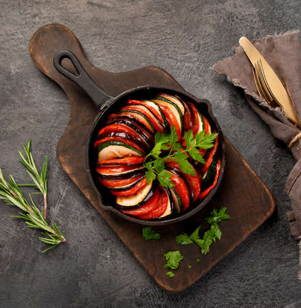 Ratatouille casserole on dark background. Traditional French food concept. Top view, flat lay, copy spaceの写真素材