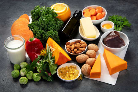 Foods high in vitamin A on dark background. Healthy diet concept.の写真素材