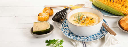 Corn soup on white background. Healthy food concept. copy space