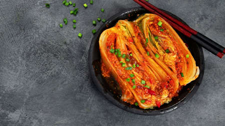 Kimchi cabbage on gray background. Traditional Korean food. Top view, flat lay, copy spaceの写真素材