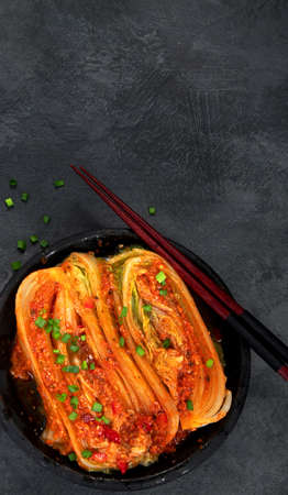 Kimchi cabbage on gray background. Traditional Korean food. Top view, flat lay, copy spaceの写真素材