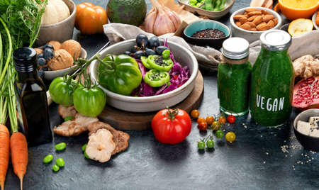 Vegan food assortment on dark background. Healthy food cocnept.