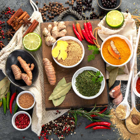Assortment of spices on gray background. Traditional seasoning concept. Top view, flat layの写真素材