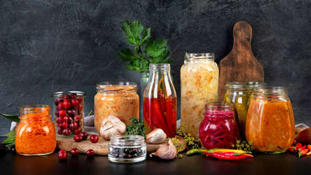 Fermented food on wooden table. High source of probiotics. Front viewの写真素材