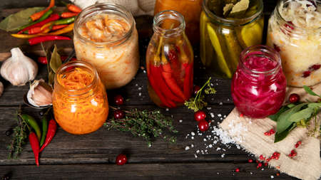 Fermented food on wooden table. High source of probiotics.の写真素材