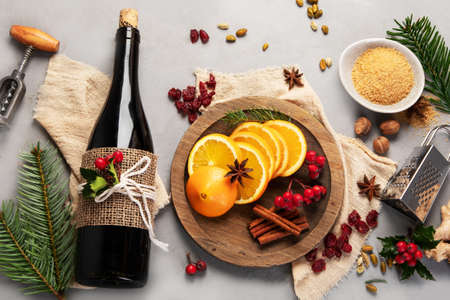 Mulled red wine on gray background. Traditional alcohol drinks. Top view, flat layの写真素材