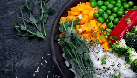 Bowl with rice, broccoli, pumpkin and microgreens. Healthy food diet concept