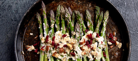 Warm salad with asparagus, cheese, nuts. top viewの写真素材