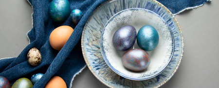 Easter background with Easter eggs. Top view, panorama, banner