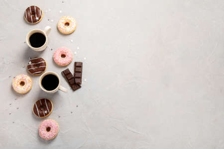 fresh donut with coffee on gray background, copy spaceの写真素材