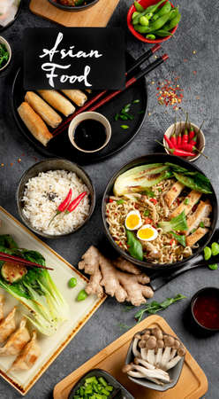 Asian food on dark background, top view.