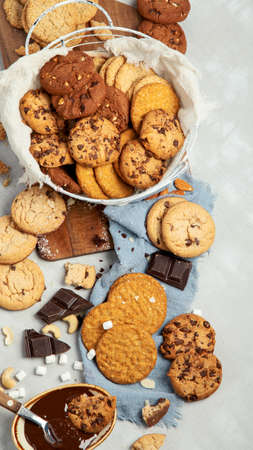 Cookies assortment on light background. homemade desserts. Celebration concept. Top view, flat lay, copy spaceの写真素材