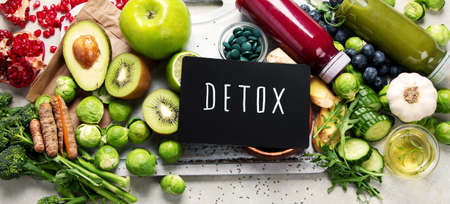 Assorted detox smoothie juices on light background. Healthy diet concept. Delicious vegetables and fruits. Top view, flat lay, panoramaの写真素材