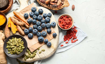 Healthy food clean eating selection on light background. Balanced diet concept. Superfood...