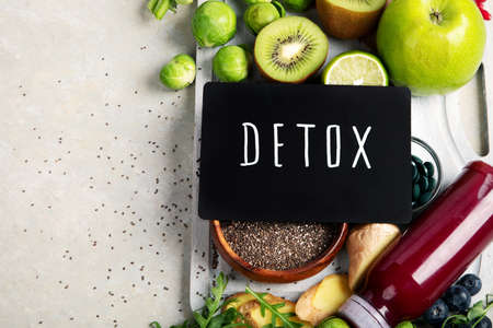 Assorted detox smoothie juices on light background. Healthy diet concept. Delicious vegetables and fruits. Top view, flat lay, copy spaceの写真素材