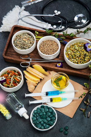 Assortment of herbal and traditional medicine. Traditional healthcare concept. Natural homoeopathic remedies. top view, flat layの写真素材