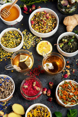 Herbal tea assortment on dark background. traditional health care. Top view, flat lay