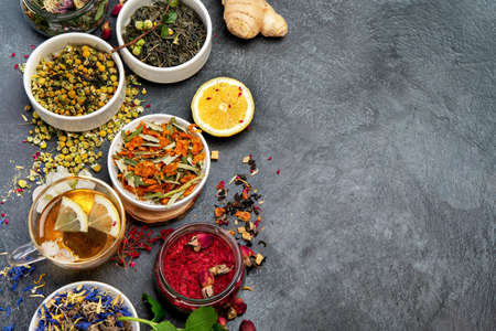 Herbal tea assortment on dark background. traditional health care. Top view, flat lay, copy spaceの写真素材