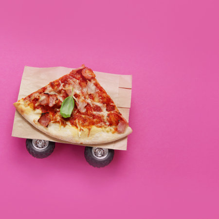 Pizza on pink background. creative conception. food delivery. Top view, flat lay, copy spaceの写真素材