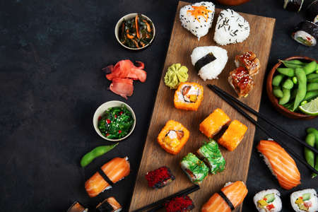 Japanese food assortment on dark background. traditional food concept. Dishes and appetizers of indeed cuisine. Top view, copy space, flat layの写真素材