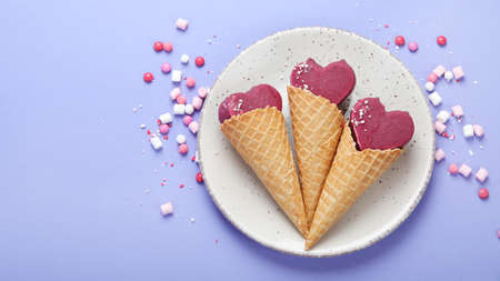 Violet blueberry ice-cream on lilac background. Atmospheric sweet menu concept. Top view, flat lay,...