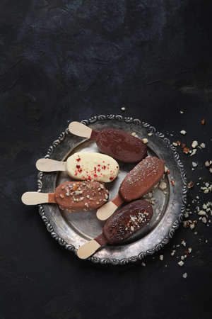 ice-cream assortment on dark background. spring natural background. Top view, flat lay, copy spaceの写真素材