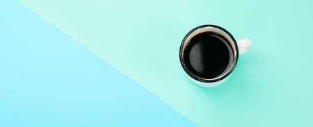 Cup of coffee on color background. modern breakfast concept. Top view, flat lay, copy space, panoramaの写真素材