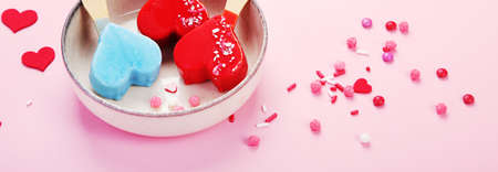 Different type of ice-cream on pink background. Atmospheric summer concept. panoramaの写真素材