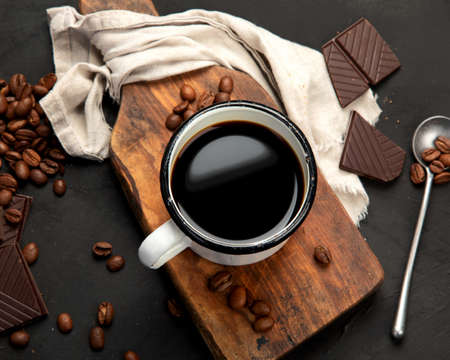Cup of black coffee on dark background. Hot drinks. breakfast concept. top view, flat layの写真素材