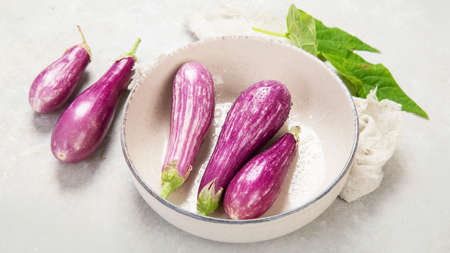 Fresh aubergine eggplant on neutral background. Popular component of healthy diets.の写真素材