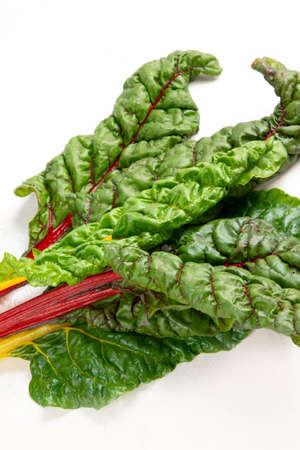 Raw chard on light background. Highly nutritious leaves. Popular component of healthy diets.
