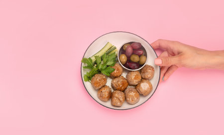 Greek meatballs keftedes on color background. Traditional food. creative photo concept. top view,...