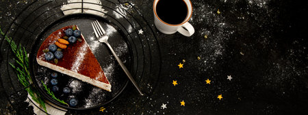 Christmas cake slice on dark background. Traditional dessert of festive time. Top view, copy space, panoramaの写真素材
