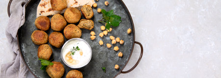 Chickpeas falafel with pita, sauce. Top view, copy space, panorama, bannerの写真素材