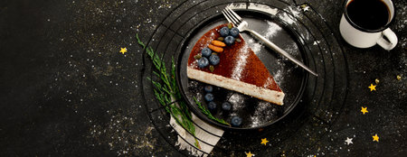 Christmas cake slice on dark background. Traditional dessert of festive time. Top view, copy space, panoramaの写真素材