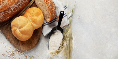 Bread assortment on neutral background. Fresh homemade pastry. top view, copy space