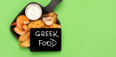 Greek food assortment on color background. Traditional food. creative photo concept. top view, copy...