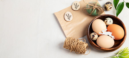 Easter eggs decorated with natural materials on a white background. top view. Minimalistic decor for...