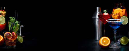 Set of various colorful cocktails on black background. Classic long drink cocktails menu concept. Copy spaceの写真素材