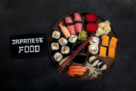 Traditional Japanese food dishes on black background, top view, copy space.の写真素材
