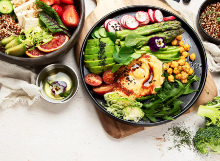 Healthy vegetarian and vegan salads and Buddha Bowls with vitamins, antioxidants, protein on light background. top view, copy spaceの写真素材