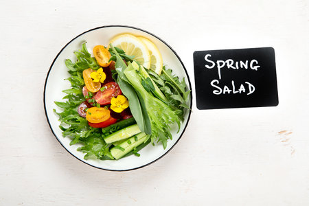 Spring vegetable salad. Tasty healthy food. top view, copy spaceの写真素材
